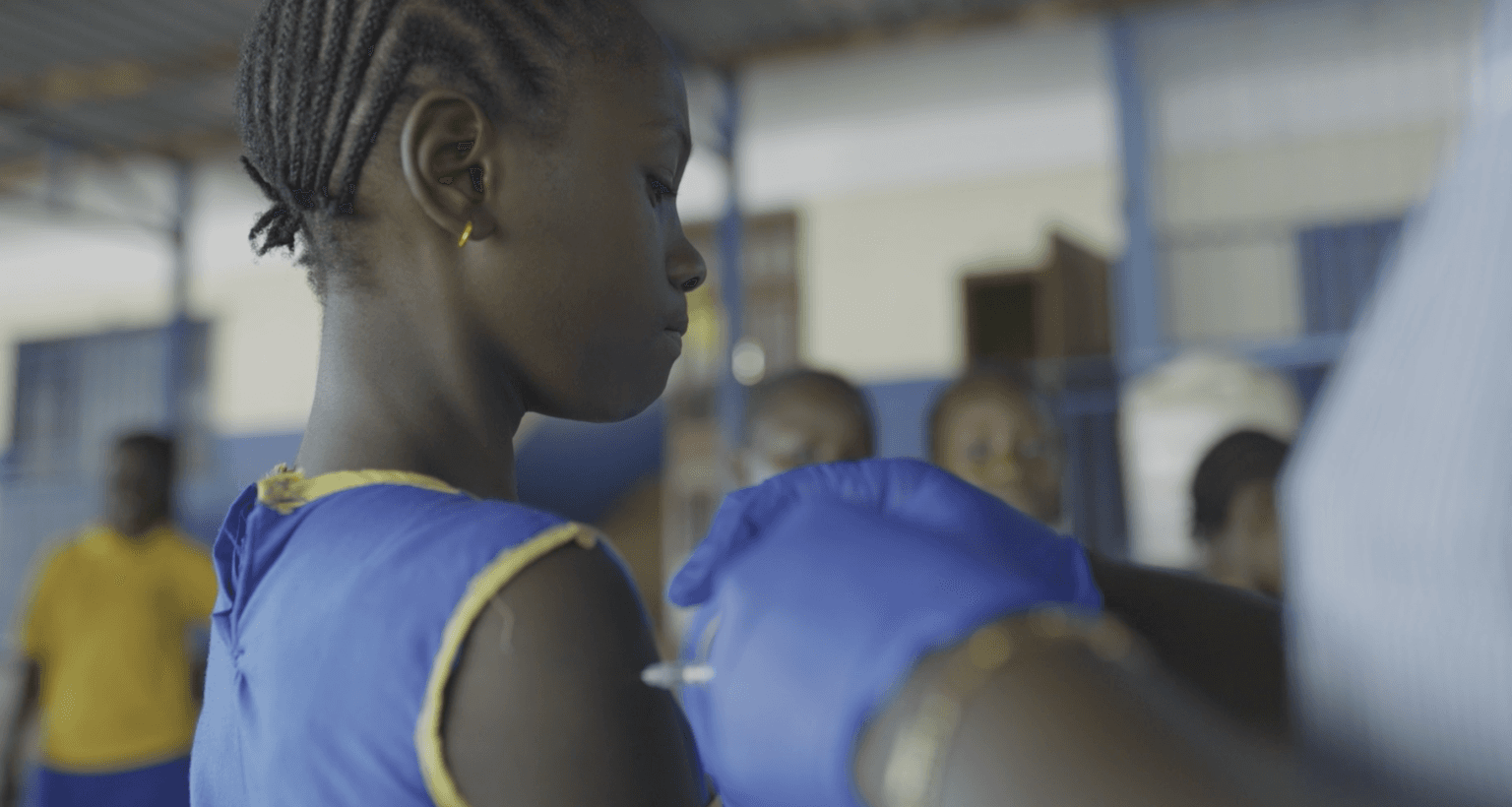 A school girl in Dwazark Community, Freetown, Sierra Leone, receives the HPV vaccine to protect against cervical cancer.